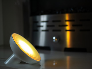 Smart home lamp light with coloured LED on fireplace - Yellow