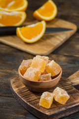Sprinkle the marmalade with sugar in a bowl on a wooden Board. Wooden background