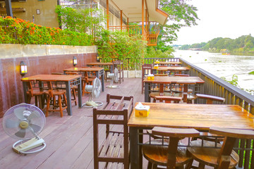 The Restaurant With a table next to the river  Is a restaurant that is open to tourists  Who visit the beauty of the Pasak river Ayutthaya thailand