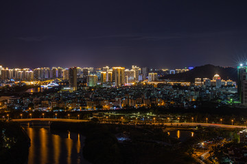 Fototapeta na wymiar China. Hainan island. Night view of the city from the tree houses