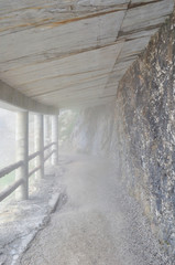 Eisriesenwelt, wooden passage in a rocky foggy landscape