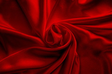 red silk delicate fabric spun and draped