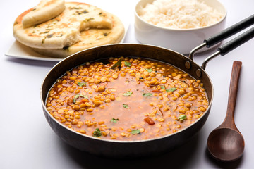 Chana Dal fry or Split Bengal Gram tadka served in a bowl or pan, selective focus