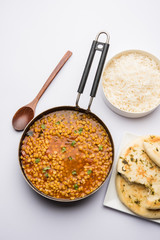 Chana Dal fry or Split Bengal Gram tadka served in a bowl or pan, selective focus