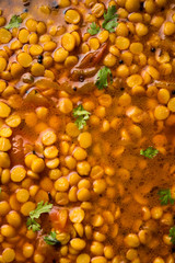Chana Dal fry or Split Bengal Gram tadka served in a bowl or pan, selective focus