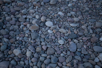 Fototapeta na wymiar Rock bed pebbles pattern on beach