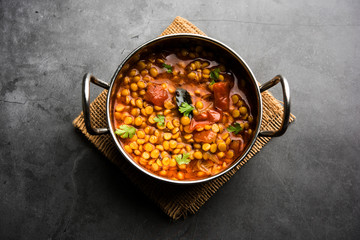 Chana Dal fry or Split Bengal Gram tadka served in a bowl or pan, selective focus