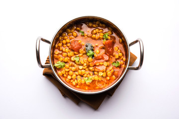 Chana Dal fry or Split Bengal Gram tadka served in a bowl or pan, selective focus