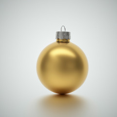 Shiny gold crimson Christmas bauble on light grey