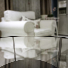 Glasses coffee table in autumn home interior. Free space for your product. 