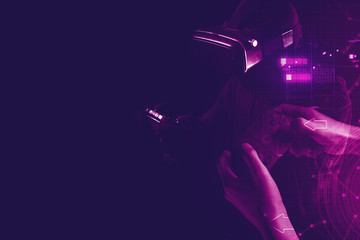 gamer boy with hand holding the joystick controller electronic for playing game with online network connection  technology device in esport tournament challenge concept © issaronow