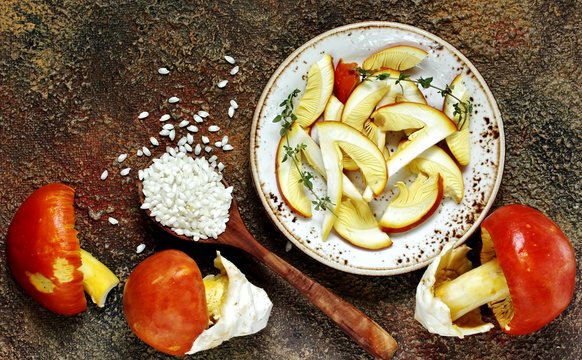 Ingredients for risotto with mushroom Tsesarskaya. Amanita Caesarea. risotto with king mushroom or Caesar. a family of fly-agarics of the highest category, a delicious mushroom. Italian Cuisine.