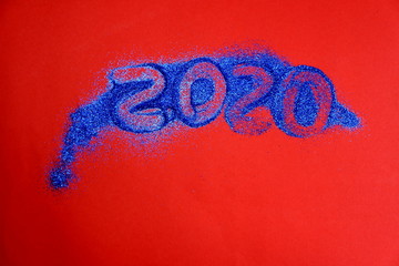 on a red background is written 2020 symbol of the new year