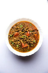 Whole Green Moong Dal fry / Whole Mung bean Tadka served in a bowl. selective focus