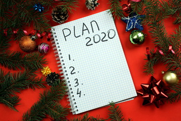 Christmas background with a notepad. plans for 2020