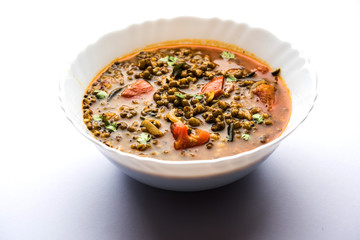 Whole Green Moong Dal fry / Whole Mung bean Tadka served in a bowl. selective focus