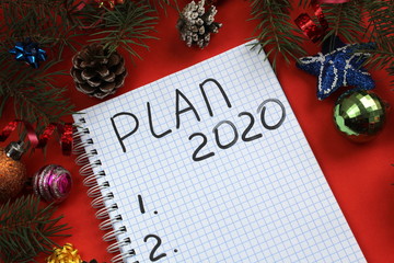Christmas background with a notepad. plans for 2020