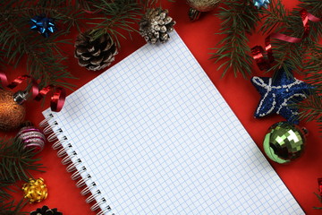 notebook  lies on the background of Christmas decoration