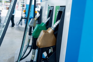 Colorful fuel nozzle at Gas station,Use color separation To tell the type.