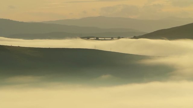 Timelapse of fog over hills