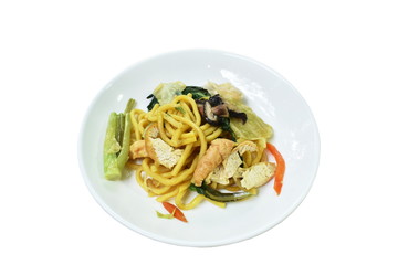 stir fried yellow noodles with cabbage and tofu vegetarian food on dish