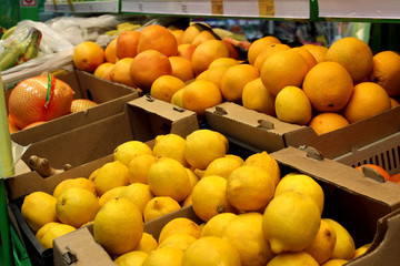 many fruit boxes standing in the store