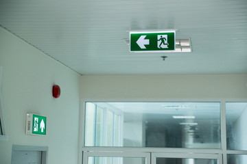 Sign : Emergency exit sign at path way indoor building public facility that emergency escape route...