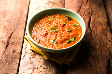 Red Lentil Cooked Dal or Dhal or Masoor daal tadka, selective focus