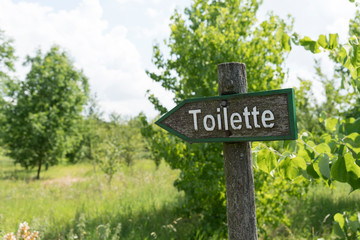 Toilette, Schild