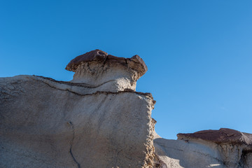 Bisti Badlands low angle landscape of grey hoodoos or rock formations in New Mexico