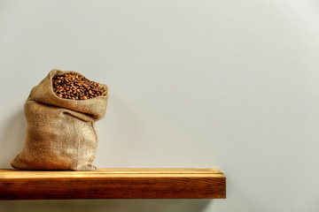 Fresh coffee on wooden shelf and free space for your decoration. 