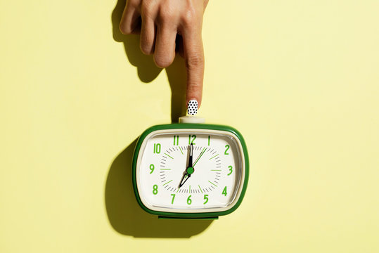 wowan turning off a retro alarm clock