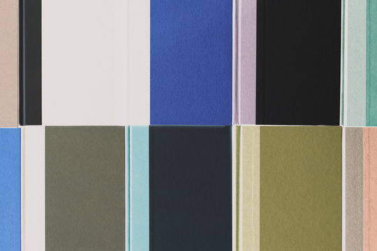 Arrangement of multicolored hardback books