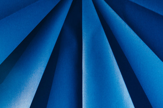 Close up of folded blue origami paper