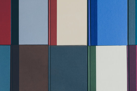 Arrangement of multicolored hardback books