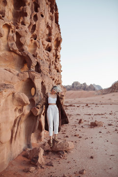 Tourist exploring Jordanian desert Wadi Rum