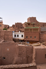 Old streets with a clay houses in Morocco.