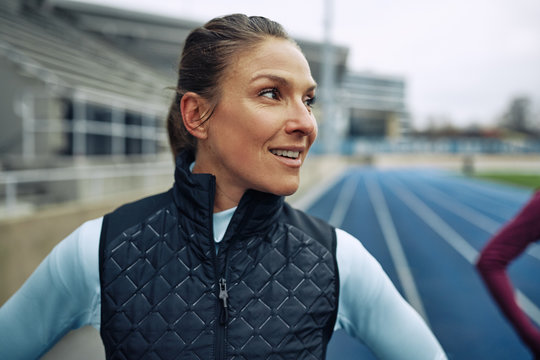 Woman smiling before a run on a track