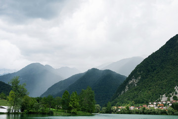 Fototapeta premium Fog over the mountains city and lake