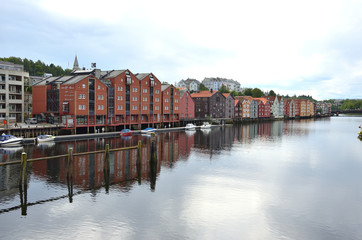 Obraz premium Wooden Colorful Houses Along the River in Trondheim, Norway