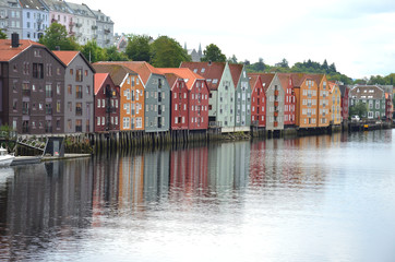 Naklejka premium Wooden Colorful Houses Along the River in Trondheim, Norway