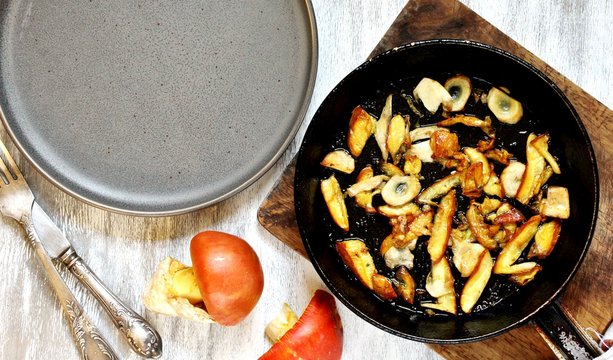 fried mushrooms Amanita Caesarea in a frying pan. a family of fly-agarics of the highest category, a delicious mushroom. copy space. top view