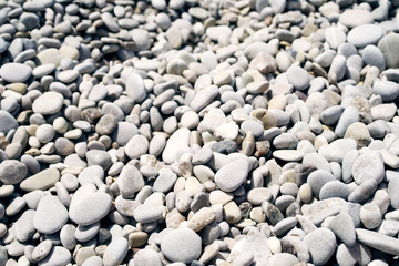Fototapeta na wymiar Pebble beach, soft focus, texture background.