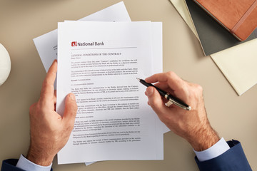 Businessman with contract of bank