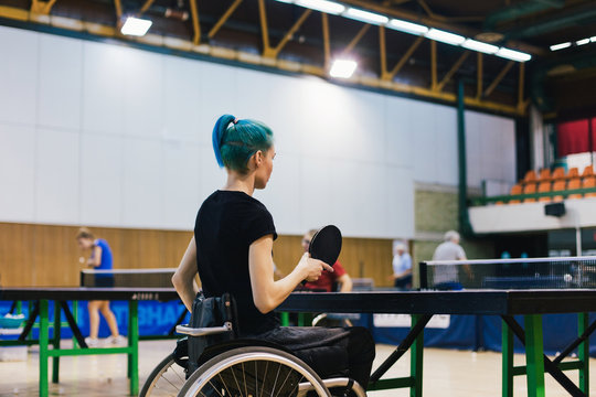 Woman in wheelchair playing table tennis