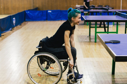 Woman in wheelchair playing table tennis