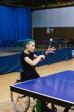 Woman in wheelchair playing table tennis