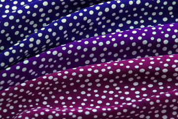 beautifully draped with soft folds, bright lilac, blue, fabric for needlework or decor, polka dot...
