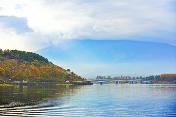 View of the Lake Kawaguchi with Mount Fuji covered in the cloud in autumn in Japan.