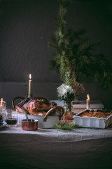 Traditional festive roasted turkey. Thanksgiving celebration in November. Christmas festive family dinner. Festive holiday season. Table setting decoration on holiday season